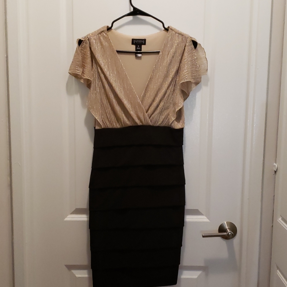 Knee length black and gold dress